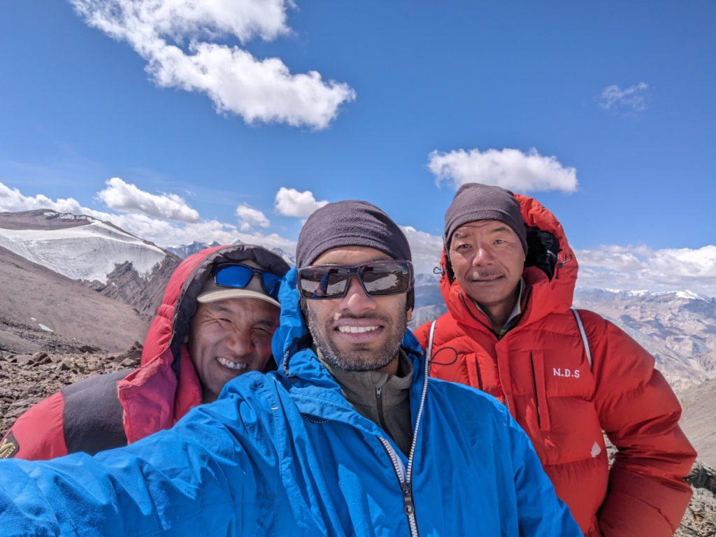 Climber on the rocky slopes of Matho Kangri