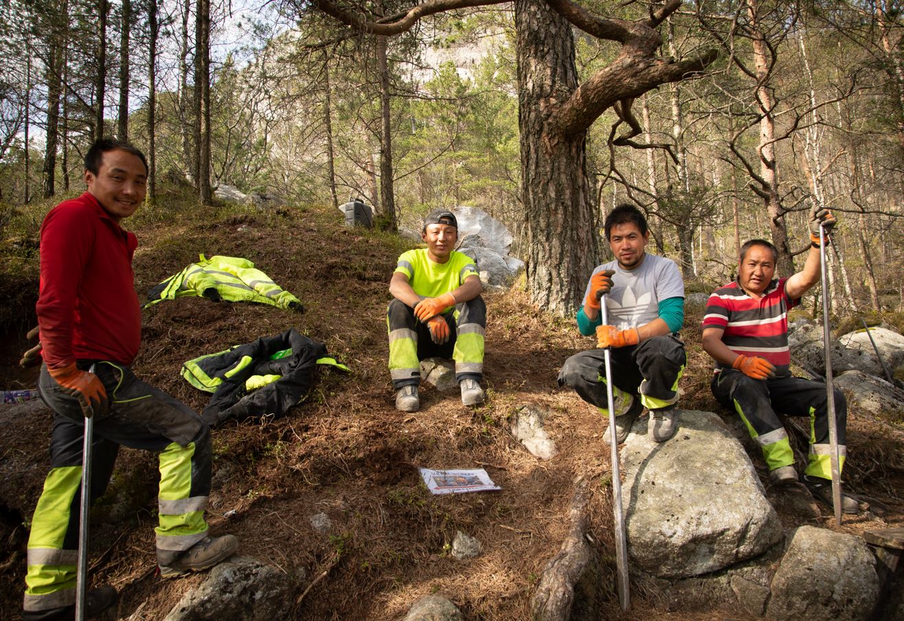 Sherpa stone-masons at work on the trail